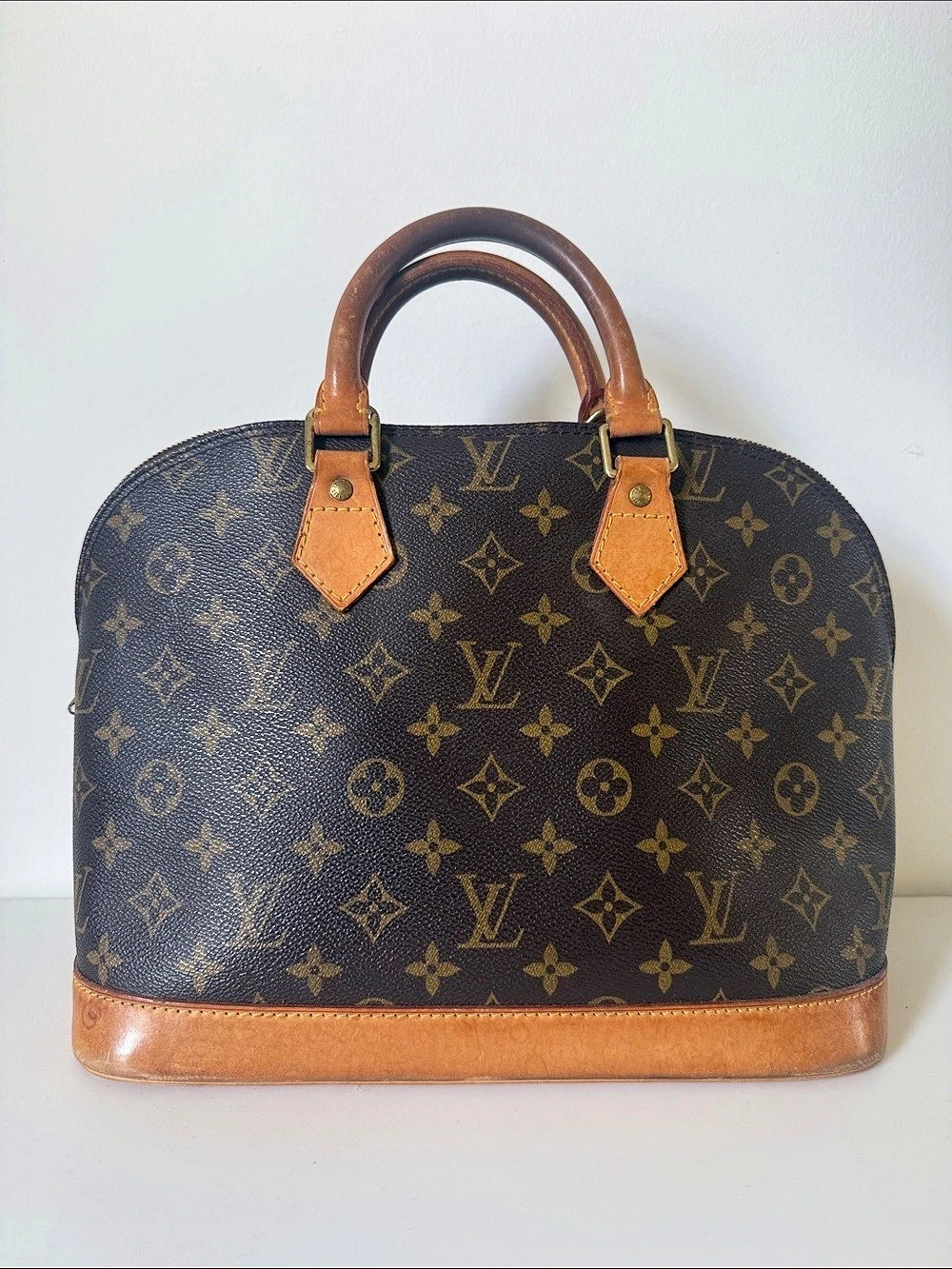 Louis Vuitton Alma PM Monogram Satchel in Brown